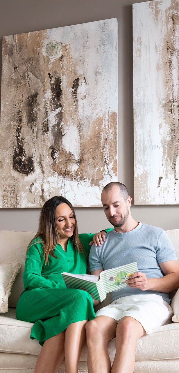 Couple sitting on their dream furniture piece