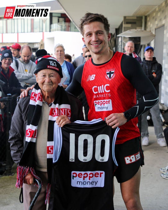 Player poses with 100 year old loyal Saints fan