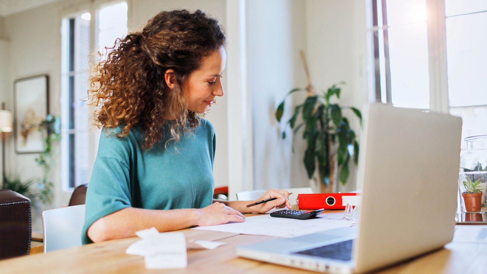 Customer doing computations Woman checking her credit report